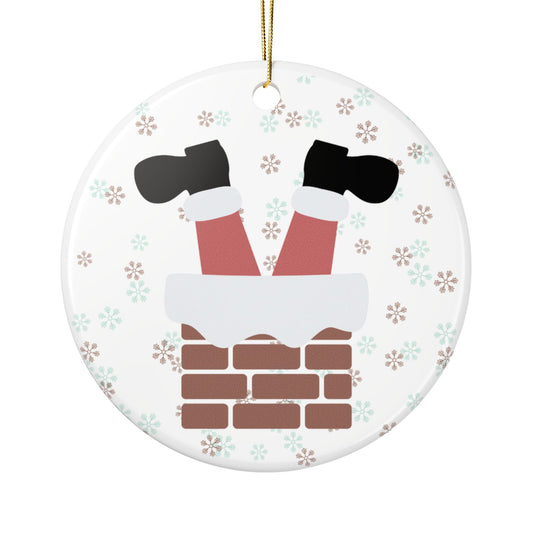 Christmas ornament with Santa's legs in a chimney on a white background