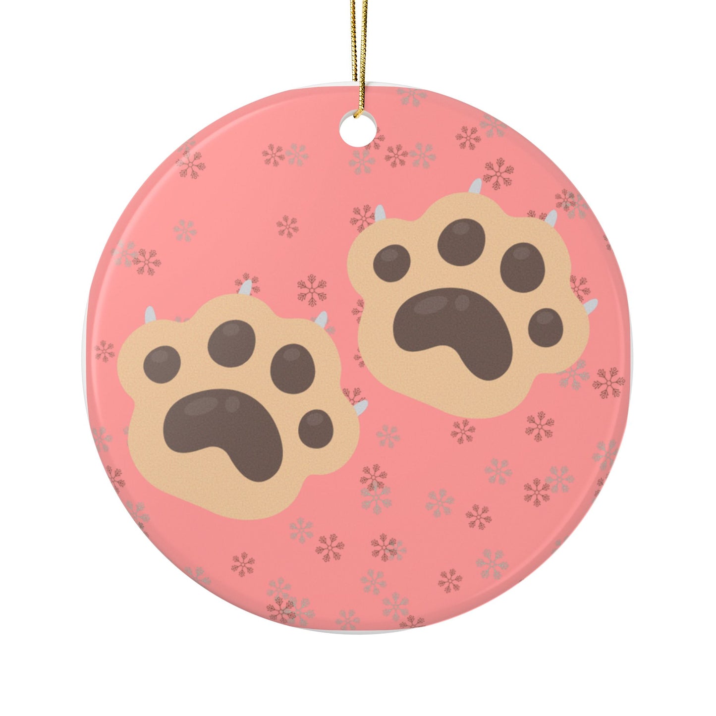 Round red ornament with paw prints on a white background