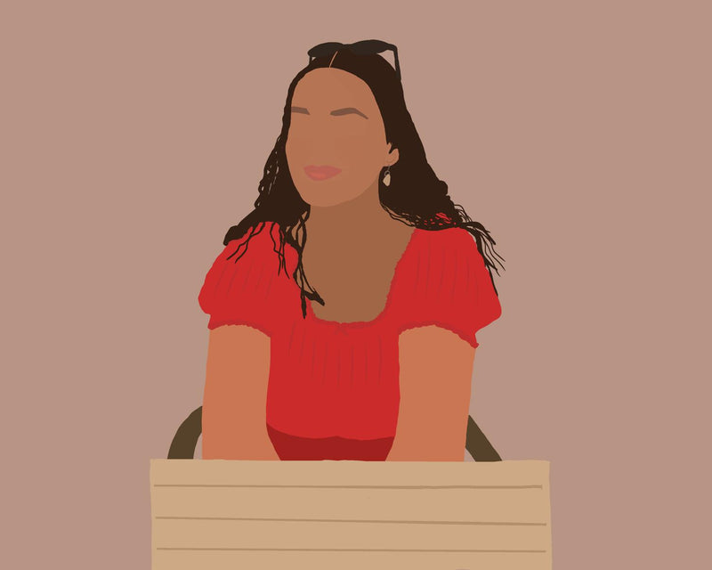 A stylized illustration of a woman with long dark hair wearing a red top, seated behind a light wood panel against a solid muted mauve background.