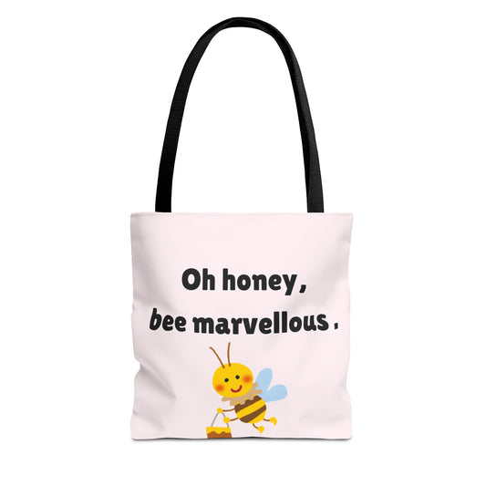 Tote bag with a bee illustration and text 'Oh honey, bee marvellous.' on a white background